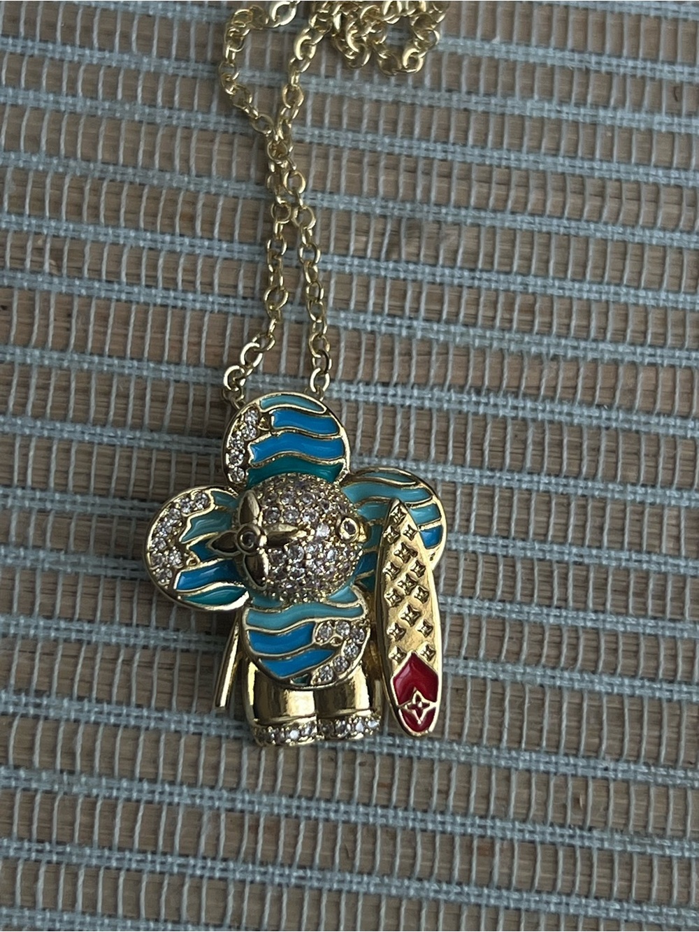 blue surfer floral gold pendant with pavé accents and detailed surfboard - Picture 3 of 5